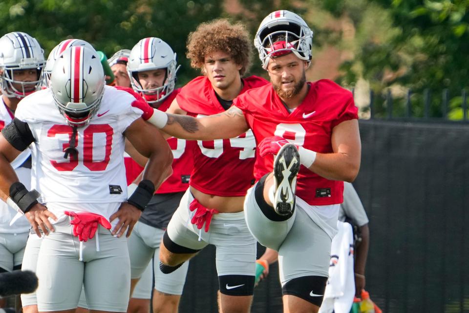Aug 4, 2022; Columbus, OH, USA;  Ohio State Buckeyes tight end Cade Stover (8) stretches during the first fall football practice at the Woody Hayes Athletic Center. Mandatory Credit: Adam Cairns-The Columbus Dispatch