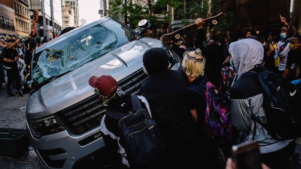 PHOTO: Protesters destroy a Chicago Police Vehicle, May 30, 2020, during a protest against the death of George Floyd. (Jim Vondruska/Zuma Press)