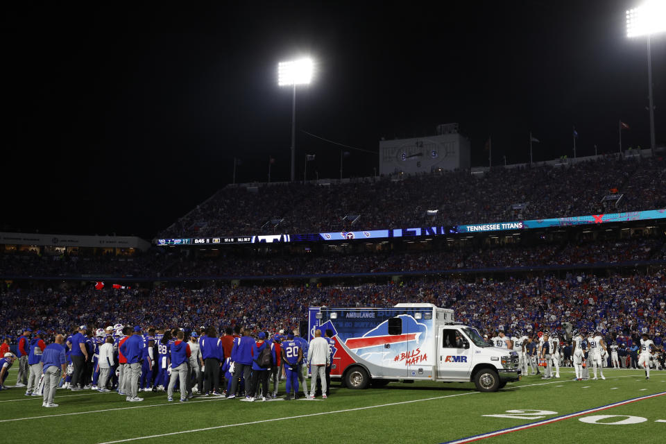 Players gather around an ambulance on the field after an injury to Buffalo Bills' Dane Jackson during the first half of an NFL football game against the Tennessee Titans, Monday, Sept. 19, 2022, in Orchard Park, N.Y. (AP Photo/Jeffrey T. Barnes)