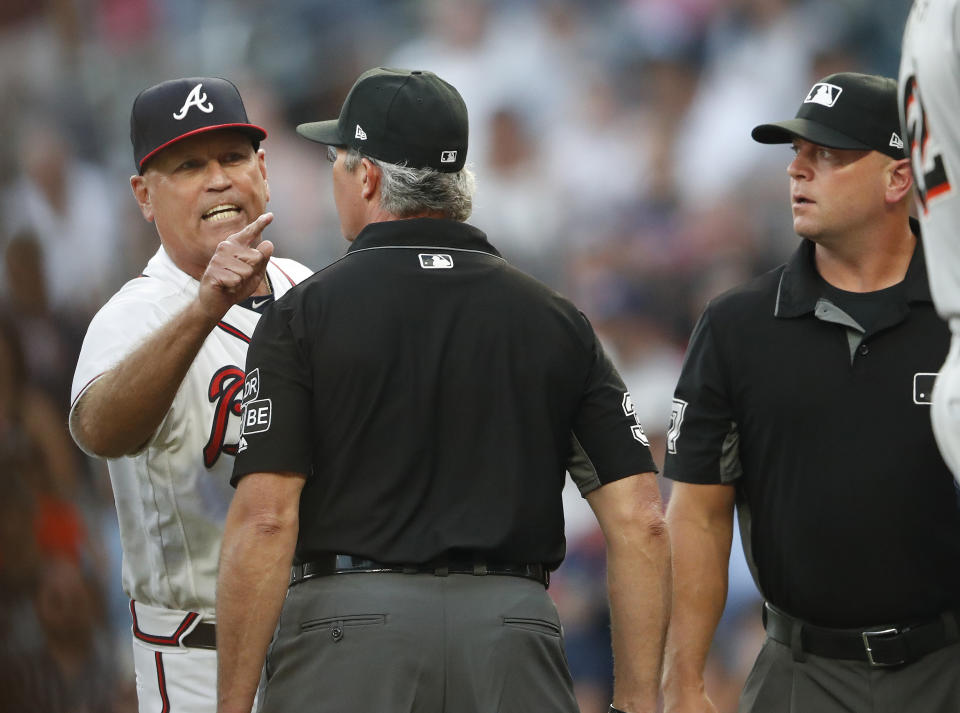 Atlanta Braves manager Brian Snitker argues with the umpiring crew after Ronald Acuna Jr was hit by a pitch from Miami Marlins starting pitcher Jose Urena during the first inning of a baseball game Wednesday , Aug. 15, 2018 in Atlanta. Urena was ejected. (AP Photo/John Bazemore)