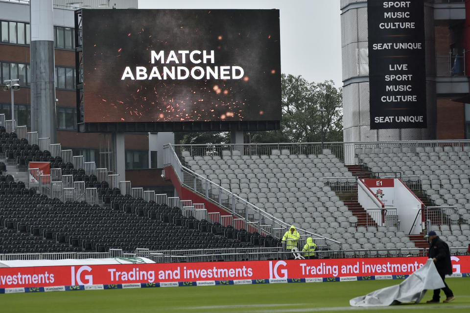 A huge screen shows the match is abandoned at the fifth day of the fourth Ashes Test match between England and Australia at Old Trafford, Manchester, England, Sunday, July 23, 2023. (AP Photo/Rui Vieira)