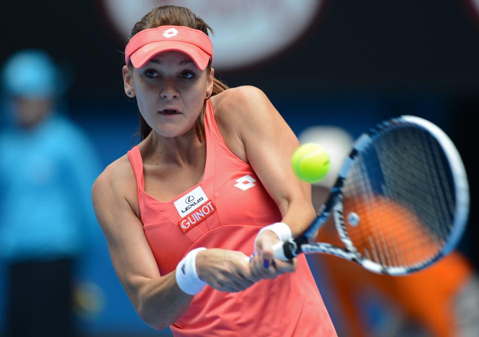 Poland's Agnieszka Radwanska hits a return against China's Li Na during their women's singles match on day nine of the Australian Open tennis tournament in Melbourne on January 22, 2013. 