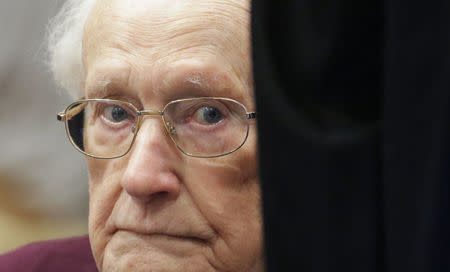 FILE PHOTO - Oskar Groening, defendant and former Nazi SS officer dubbed the "bookkeeper of Auschwitz", sits in the courtroom during his trial in Lueneburg, Germany, July 15, 2015. REUTERS/Axel Heimken/Pool/File photo