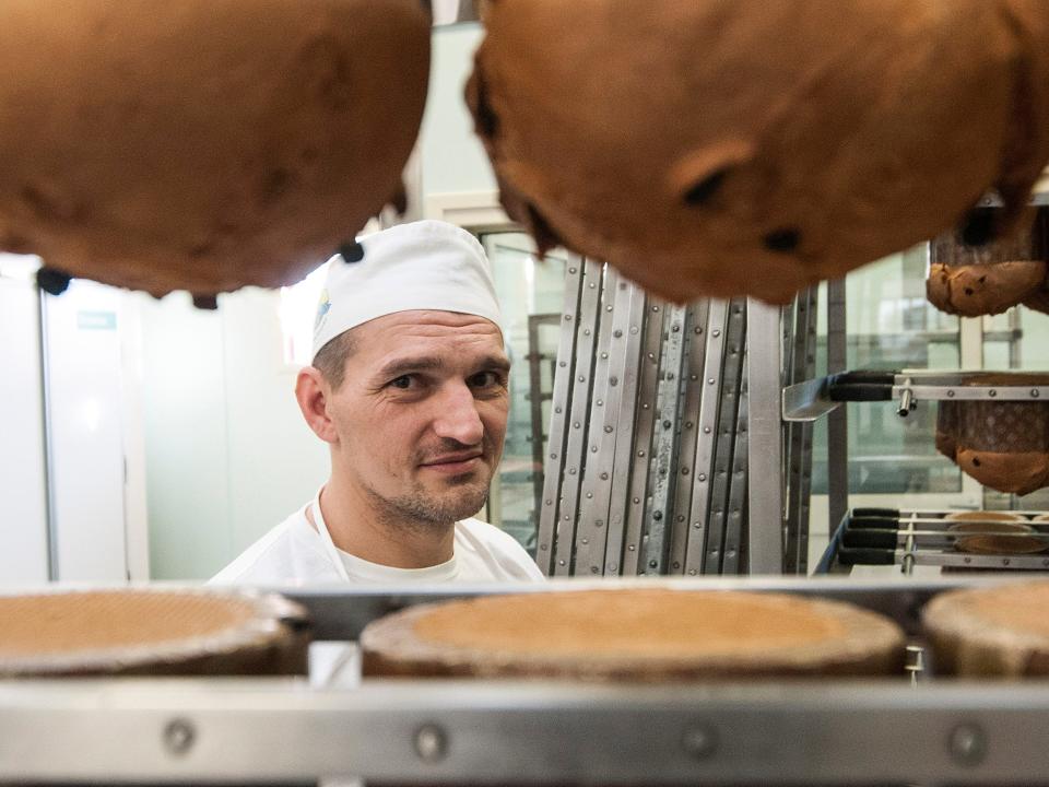 PADOVA, VENETO - NOVEMBER 27: A prisoner looks on in the bakery on November 27, 2015 in Padova, Italy. Inmates working for the Giotto Cooperative as bakers produce traditional panettone Christmas cake at the state maximum security jail Due Palazzi in Padova. (Photo by Awakening/Getty Images)