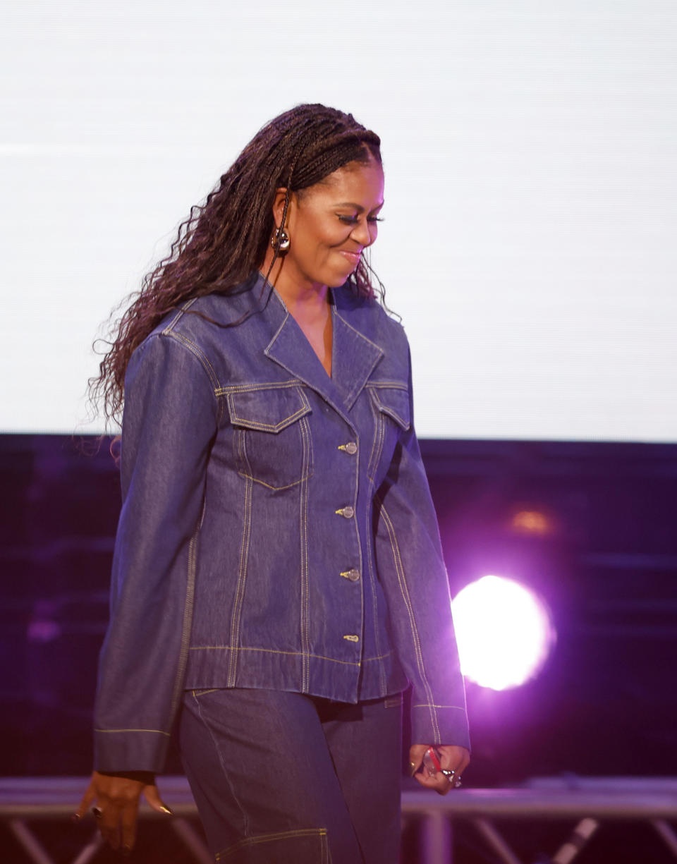 Michelle Obama walks onstage during the Michelle Obama: The Light We Carry Tour 