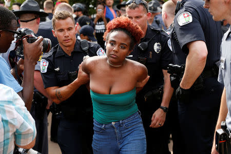 Police detain a counter-protester during the aftermath of a rally by members of the Ku Klux Klan in support of Confederate monuments in Charlottesville, Virginia, U.S. July 8, 2017. REUTERS/Jonathan Ernst