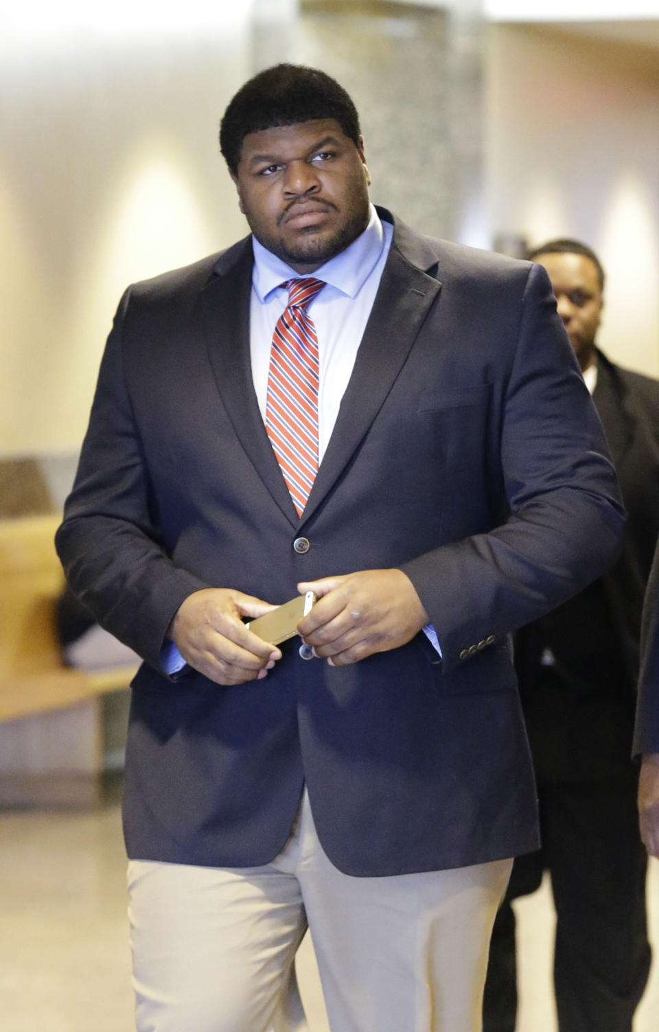 Former Dallas Cowboys NFL football player Josh Brent arrives at court for closing arguments in his intoxication manslaughter trial Tuesday, Jan. 21, 2014, in Waco, Texas. Lawyers wrapped up their closing arguments Tuesday morning before the case went to the jury for deliberations. Prosecutors accuse the former defensive tackle of drunkenly crashing his Mercedes near Dallas during a night out in December 2012, killing his good friend and teammate, Jerry Brown. (AP Photo/LM Otero)