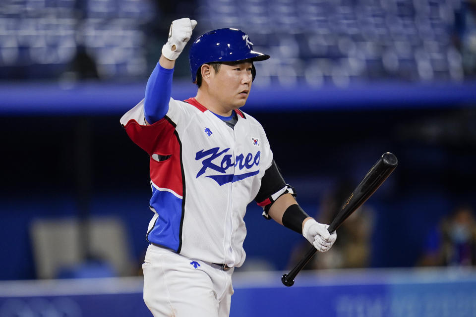 South Korea's Euiji Yang reacts after being hit by pitch to walk in the winning run during the tenth inning of a baseball game against Israel at the 2020 Summer Olympics, Thursday, July 29, 2021, in Yokohama, Japan. South Korea won 6-5.(AP Photo/Sue Ogrocki)