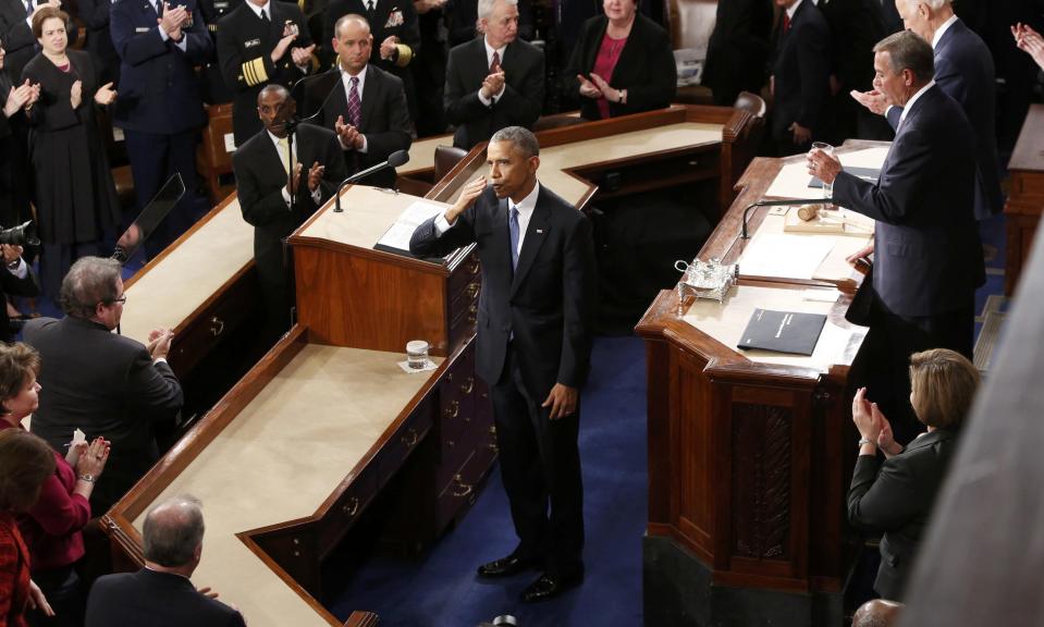 U.S. President Obama blows a kiss to his wife, first lady Michelle Obama at the end of his State of the Union address to a joint session of the U.S. Congress on Capitol Hill in Washington