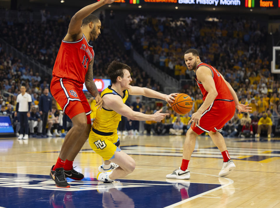 Marquette Golden Eagles Tyler Kolek passes the ball against St. John's during the first half of an NCAA college basketball game Saturday, Feb. 10, 2024, in Milwaukee. (AP Photo/Jeffrey Phelps)