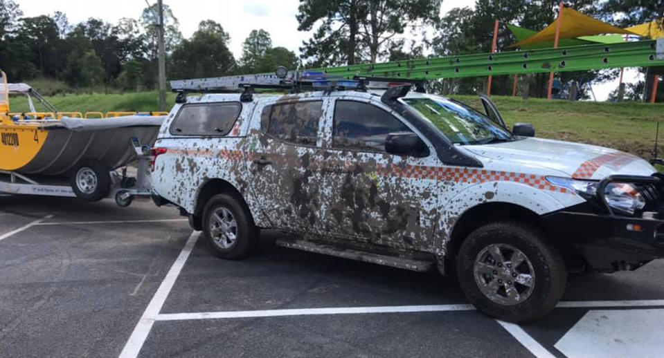 A Logan City SES vehicle parked at Loganlea Boat Ramp with mud on the door.