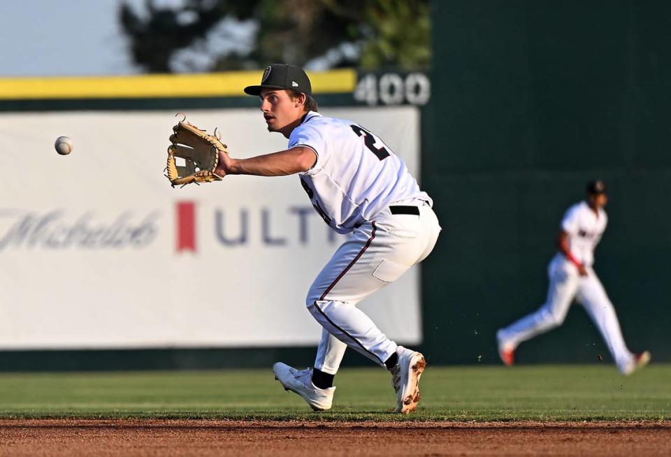 The Modesto Nuts second baseman Cole Young fields a grounder during a game with the Fresno Grizzlies at John Thurman Field in Modesto, Calif., Thursday, June 22, 2023. Fresno won the game 4-3.