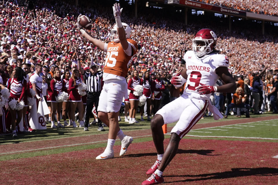 Texas wide receiver Rett Andersen (35) celebrates scoring a touchdown against Oklahoma defensive back Gentry Williams (9) during the first half of an NCAA college football game at the Cotton Bowl in Dallas, Saturday, Oct. 7, 2023. (AP Photo/LM Otero)