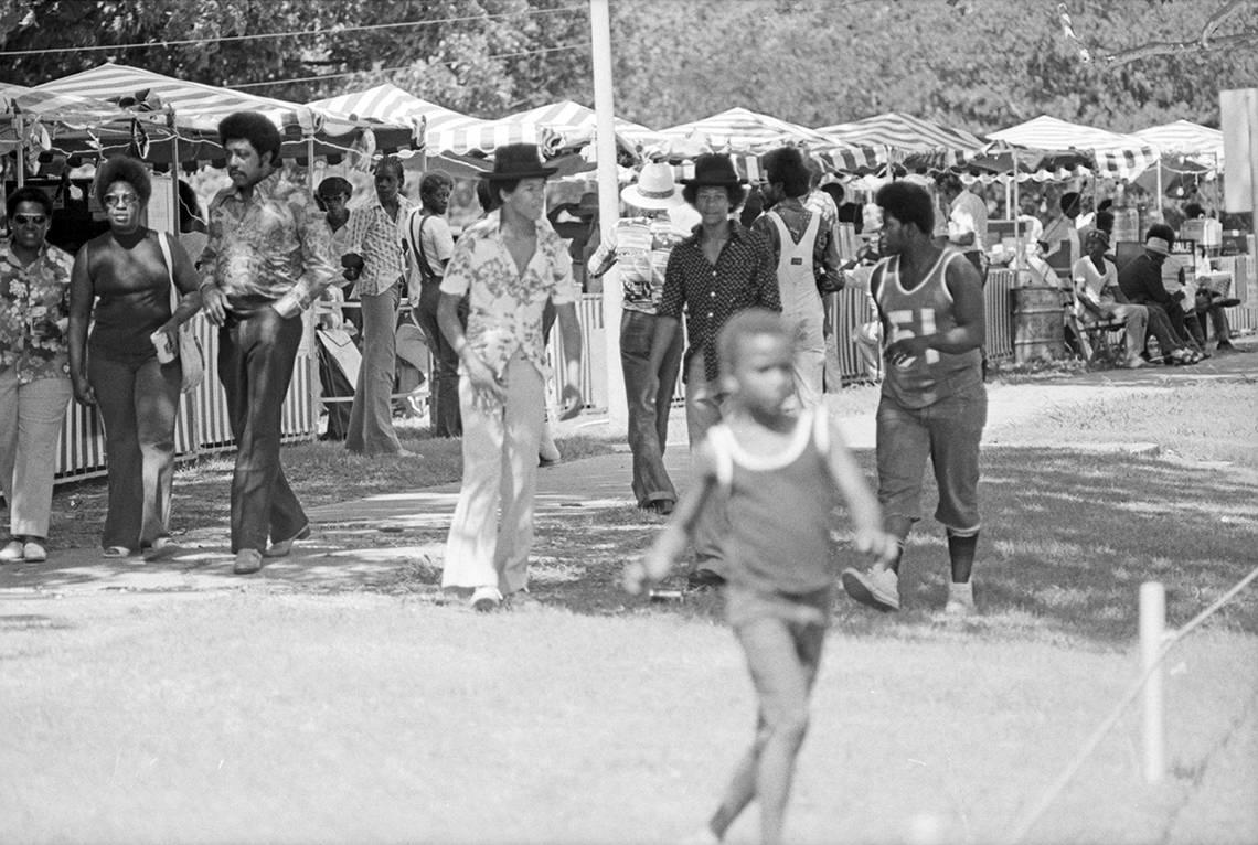 View of the crowd at Sycamore Park during Juneteenth festivities in 1975. This was the second year the Community Development Fund sponsored the Juneteenth observance in Fort Worth.