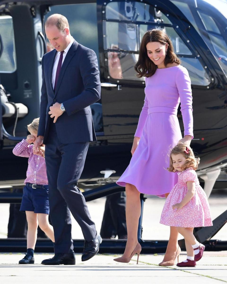 Prince George and Princess Charlotte walk with their parents, the Duke and Duchess of Cambridge, as they visit Airbus in Hamburg (PA)