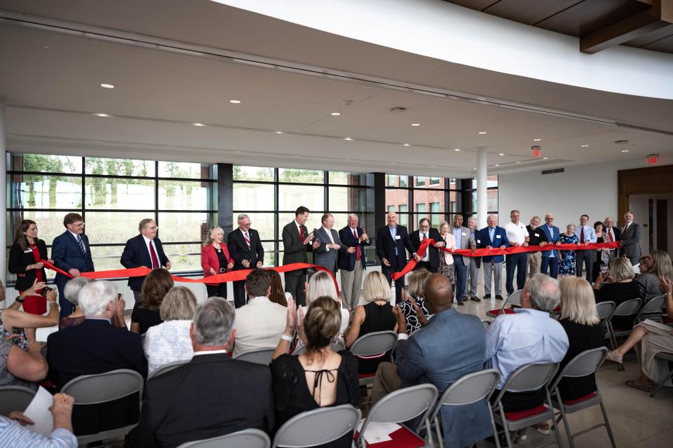 Members of the JSU administration and the Board of Trustees officially cut the ribbon on the new Merrill Hall.