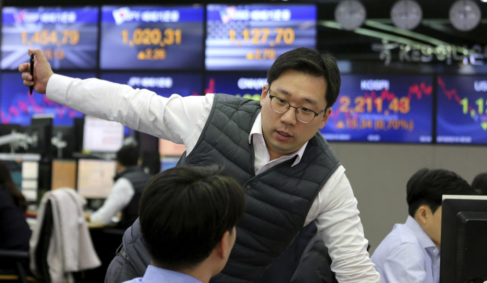 A currency trader works at the foreign exchange dealing room of the KEB Hana Bank headquarters in Seoul, South Korea, Monday, Feb. 18, 2019. Asian markets were broadly higher on Monday as traders looked forward to the continuation of trade talks between Chinese and American officials in Washington this week. (AP Photo/Ahn Young-joon)