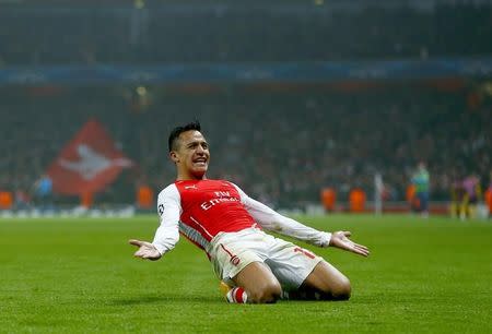 Arsenal's Alexis Sanchez celebrates after scoring a goal against Borussia Dortmund during their Champions League group D soccer match in London November 26, 2014. REUTERS/Eddie Keogh