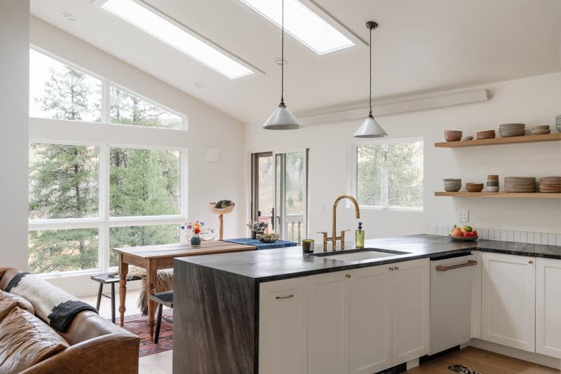 Bright and sunny kitchen and dining room in mountain home.