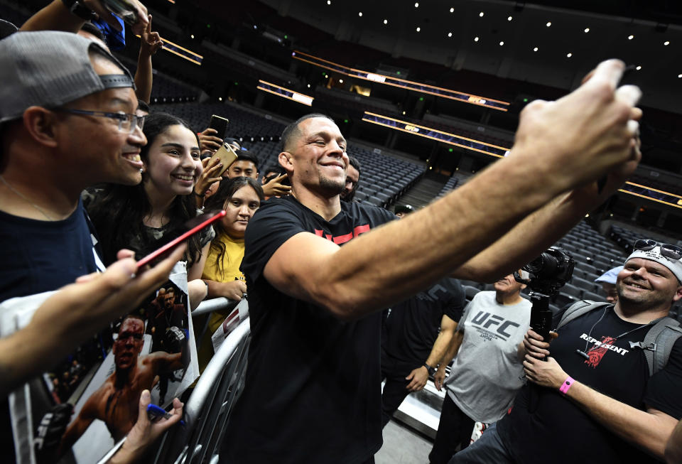 ANAHEIM, CA - AUGUST 14: Former UFC lightweight title challenger Nate Diaz takes a selfie with fans after holding an open workout for fans and media at Honda Center on August 14, 2019 in Anaheim, California. (Photo by Kevork Djansezian/Zuffa LLC/Zuffa LLC)