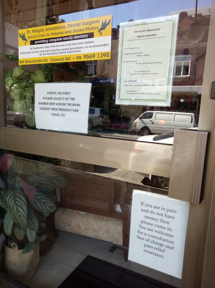 Sign in Dulwich Hill in Sydney on dentist surgery offering free services to people in pain with no money. 