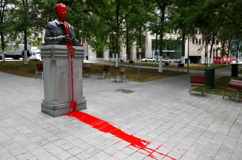 Statue of former Belgian King Baudouin is seen covered in red paint in Brussels