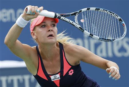 Agnieszka Radwanska of Poland hits a return to Anastasia Pavlyuchenkova of Russia at the U.S. Open tennis championships in New York August 30, 2013. REUTERS/Ray Stubblebine