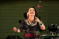 WeiWei Wuu plays erhu as she sings in front of festivalgoers in Tokyo, Saturday, Sept. 24, 2022, during an annual event called Japan-China Exchange Festival to celebrate the 50th anniversary of the normalization of the bilateral relations. The festival, after a two-year hiatus due to the COVID-19 pandemic, was back last weekend ahead of this week’s 50th anniversary of the normalizing of relations between the two Asian neighbors and economic powerhouses. (AP Photo/Hiro Komae)