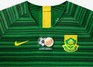 <p>The away kit is a bold green with a cascading horizontal pattern. </p>