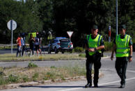 Spanish civil guards patrol outside the prison where two of the five men cleared of gang rape of a teenager and convicted of a lesser crime of sexual abuse are due to leave jail after being granted provisional release in Alcala de Henares, near Madrid, Spain, June 22, 2018. REUTERS/Javier Barbancho