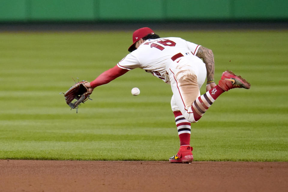 St. Louis Cardinals second baseman Kolten Wong is unable to reach a single by Milwaukee Brewers' Orlando Arcia during the fifth inning of a baseball game Saturday, Sept. 26, 2020, in St. Louis. (AP Photo/Jeff Roberson)