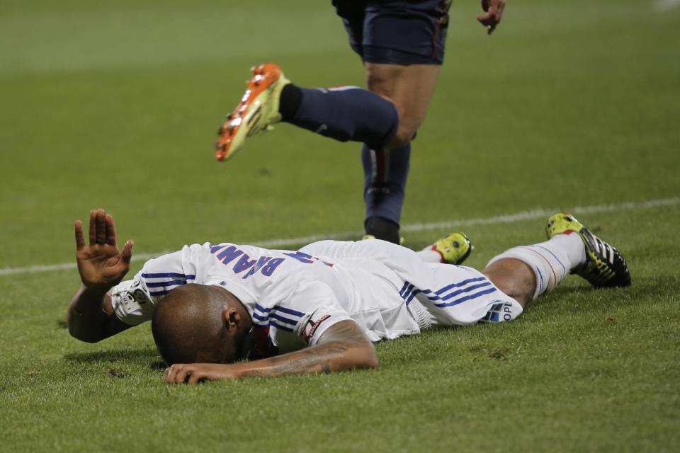 Lyon's Jimmy Brian reacts during their French League One soccer match against Paris Saint Germain, in Lyon, central France, Sunday, April 13, 2014. (AP Photo/Laurent Cipriani)