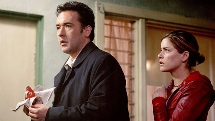 John Cusack and Amanda Peet in Identity.