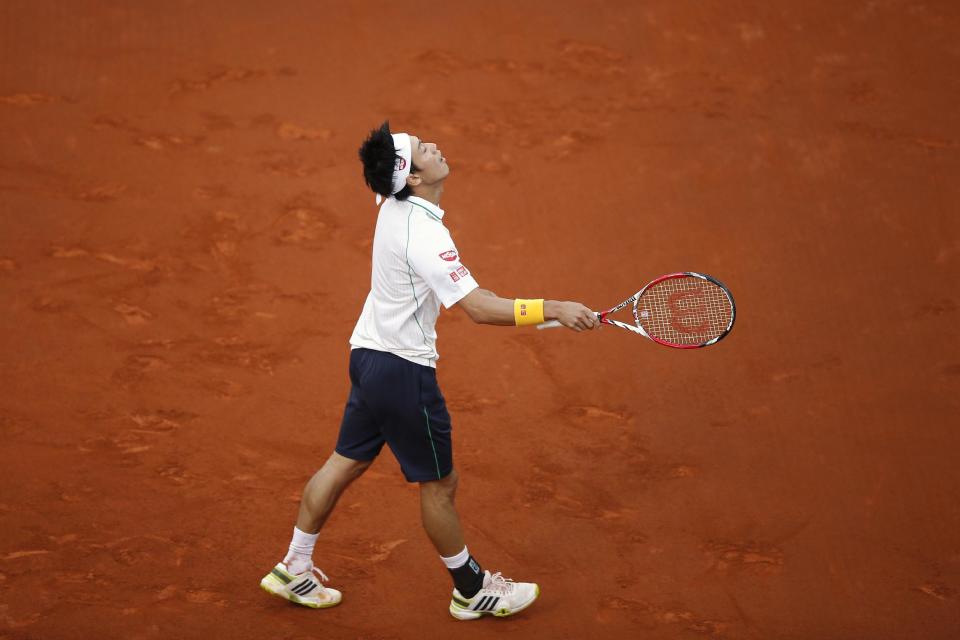 Kei Nishikori from Japan reacts during the Madrid Open tennis tournament men's final match against Rafael Nadal in Madrid, Spain, Sunday, May 11, 2014 . (AP Photo/Daniel Ochoa de Olza)