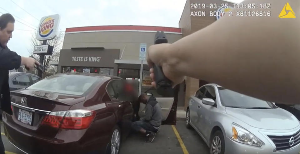 In this frame grab from a Charlotte-Mecklenburg Police Department officer body camera released Monday, April 15, 2019, shows two officers approaching 27-year-old Danquirs Napoleon Franklin outside a Burger King on March 29, 2019 in Charlotte, NC. Franklin was shot and killed. (Charlotte-Mecklenburg Police Department via AP)