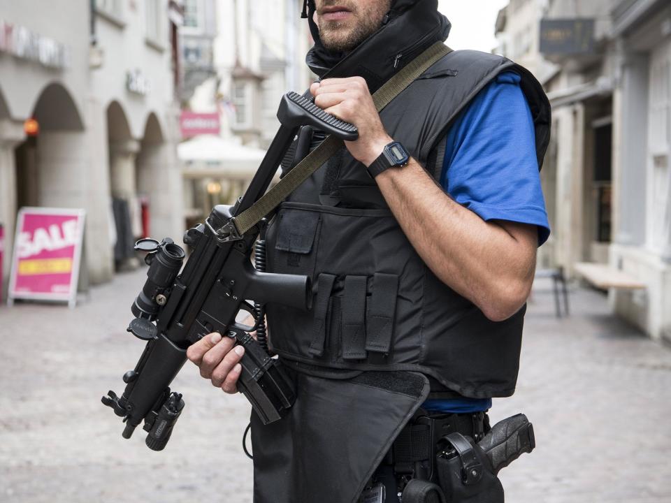 Armed police in the old town of Schaffhausen as officers search for the attacker: EPA