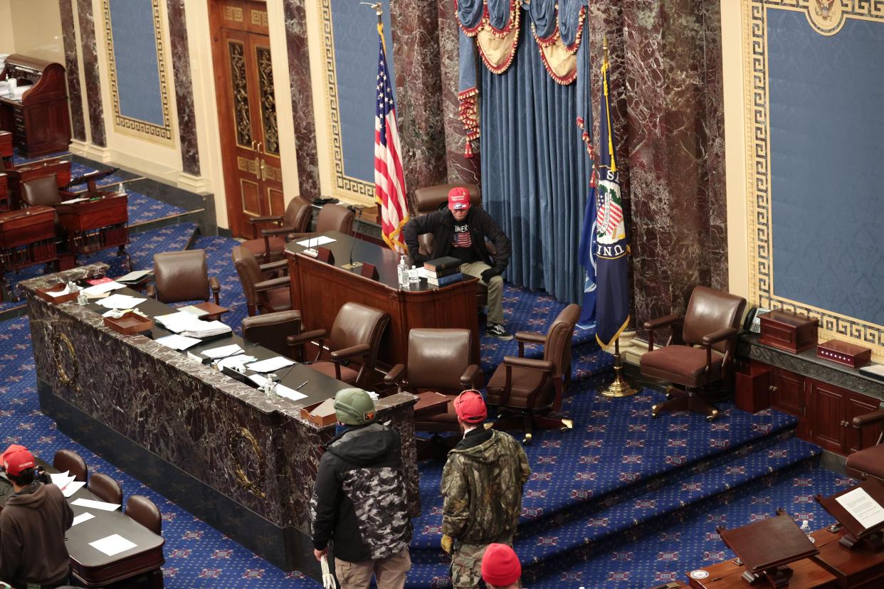 Protesters enter the Senate Chamber on January 06, 2021, in Washington, DC.