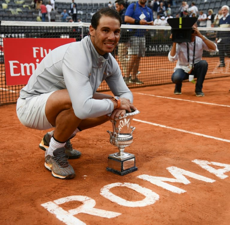 Comeback king: Rafael Nadal poses with the trophy