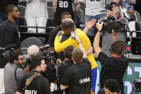 May 22, 2017; San Antonio, TX, USA; Golden State Warriors small forward Kevin Durant (right) hugs San Antonio Spurs shooting guard Manu Ginobili (left) after game four of the Western conference finals of the NBA Playoffs at AT&T Center. Mandatory Credit: Soobum Im-USA TODAY Sports