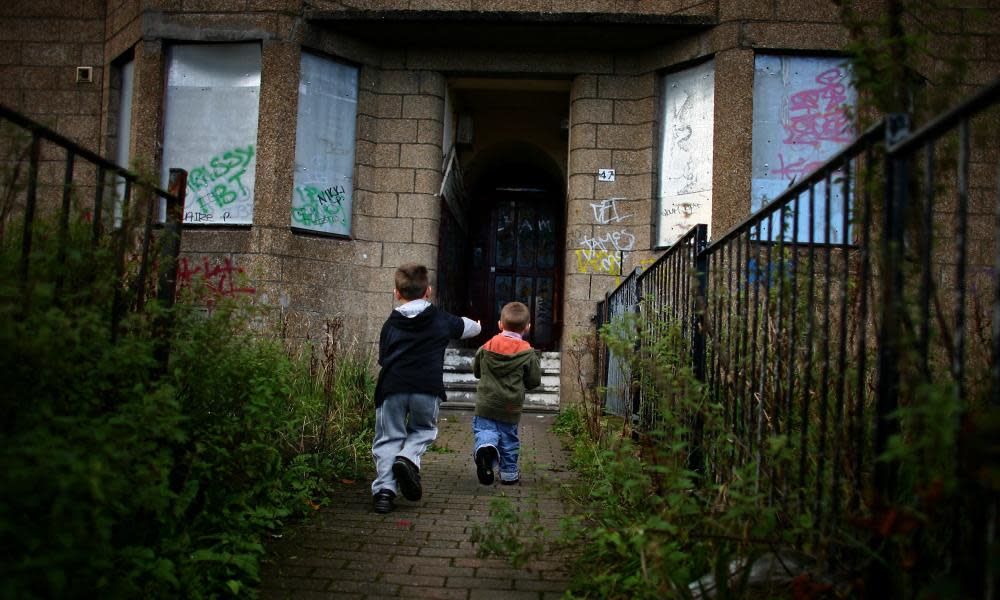 Young boys play in a run-down street