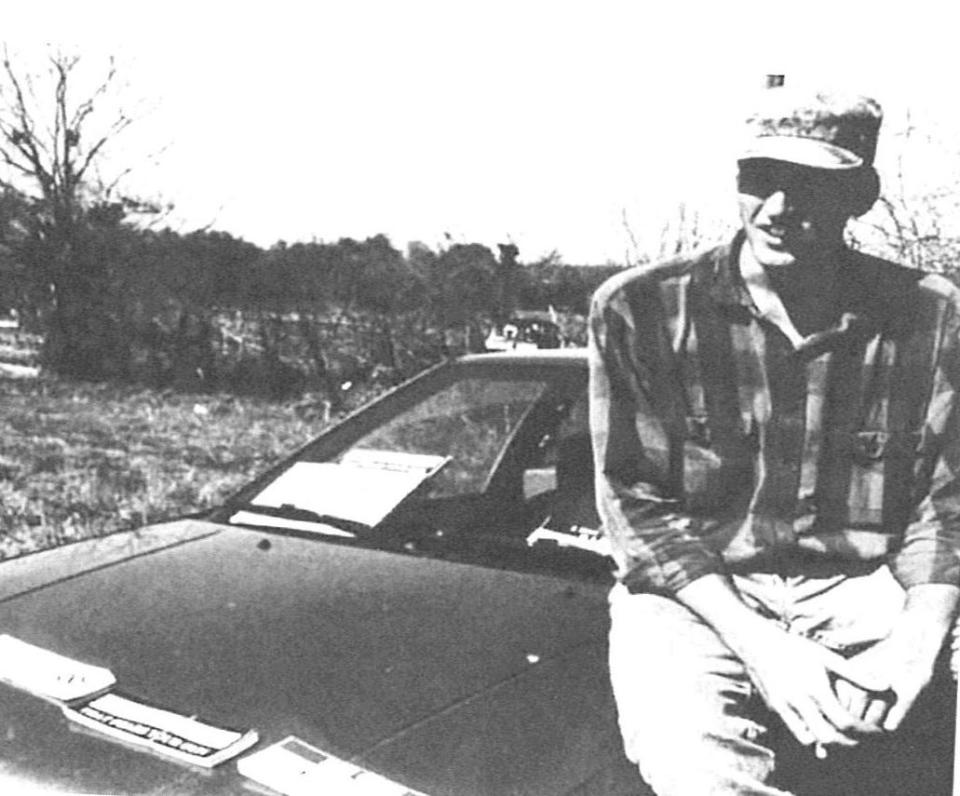 Timothy McVeigh, on the hood of his car near Mount Carmel during the Branch Davidian siege in 1993. Two years later, he blew up a federal building in Oklahoma city.