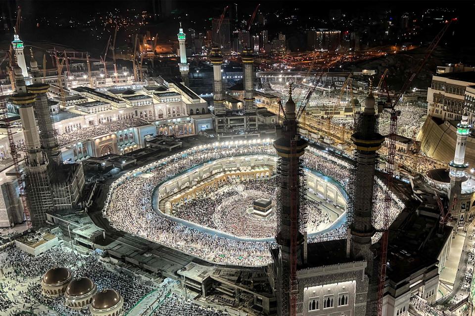 In this elevated view from a hotel overlooking the Grand Mosque, Muslim worshippers and pilgrims gather around the Kaaba, Islam's holiest shrine, in the holy city of Mecca on June 22, 2023, as they arrive for the annual Hajj pilgrimage.