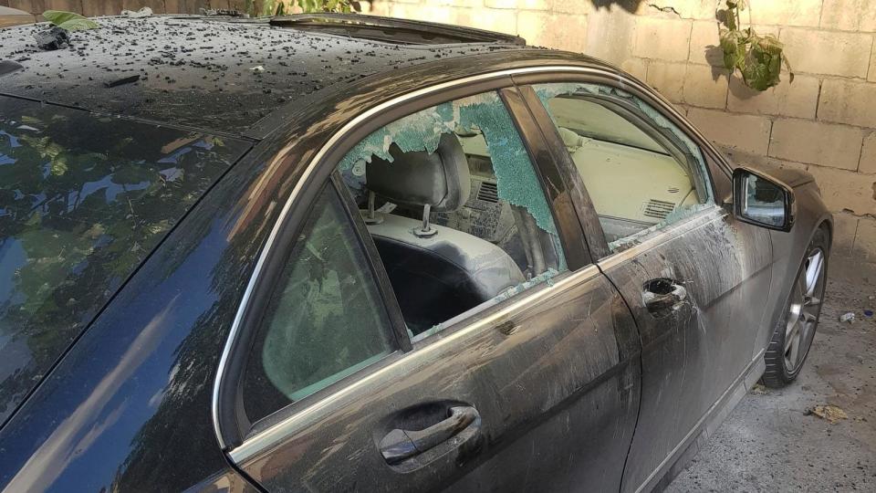 PHOTO: A partly damaged car after what is believed to be the result of a walkie-talkie exploding inside it, in the southern port city of Sidon, Lebanon, Sept. 18, 2024. (Mohammad Zaatari/AP)