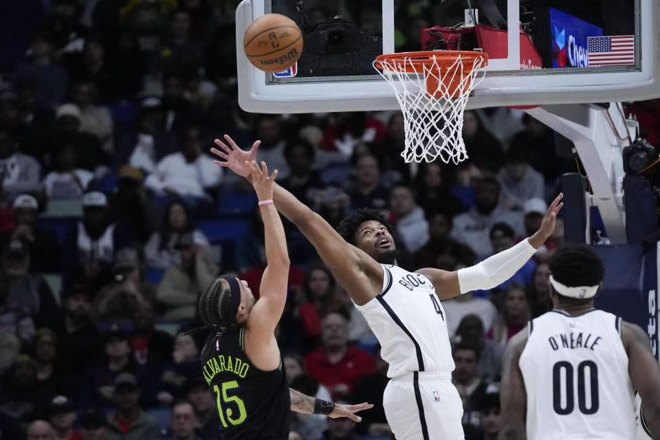 New Orleans Pelicans guard Jose Alvarado (15) shoots against Brooklyn Nets guard Dennis Smith Jr. (4) in the first half of an NBA basketball game in New Orleans, Tuesday, Jan. 2, 2024. (AP Photo/Gerald Herbert)