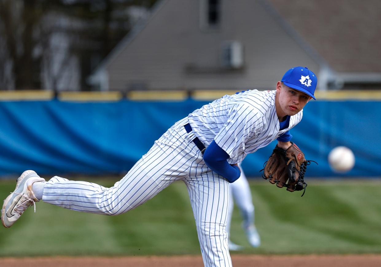 Adrian's Sean Parker delivers a pitch during a doubleheader against Gaylord St. Mary's.