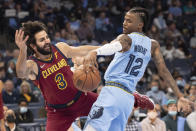 Cleveland Cavaliers' Ricky Rubio (3) and Memphis Grizzlies guard Ja Morant (12) vie for the ball during the first half of an NBA basketball game Wednesday, Oct. 20, 2021, in Memphis, Tenn. (AP Photo/Nikki Boertman)