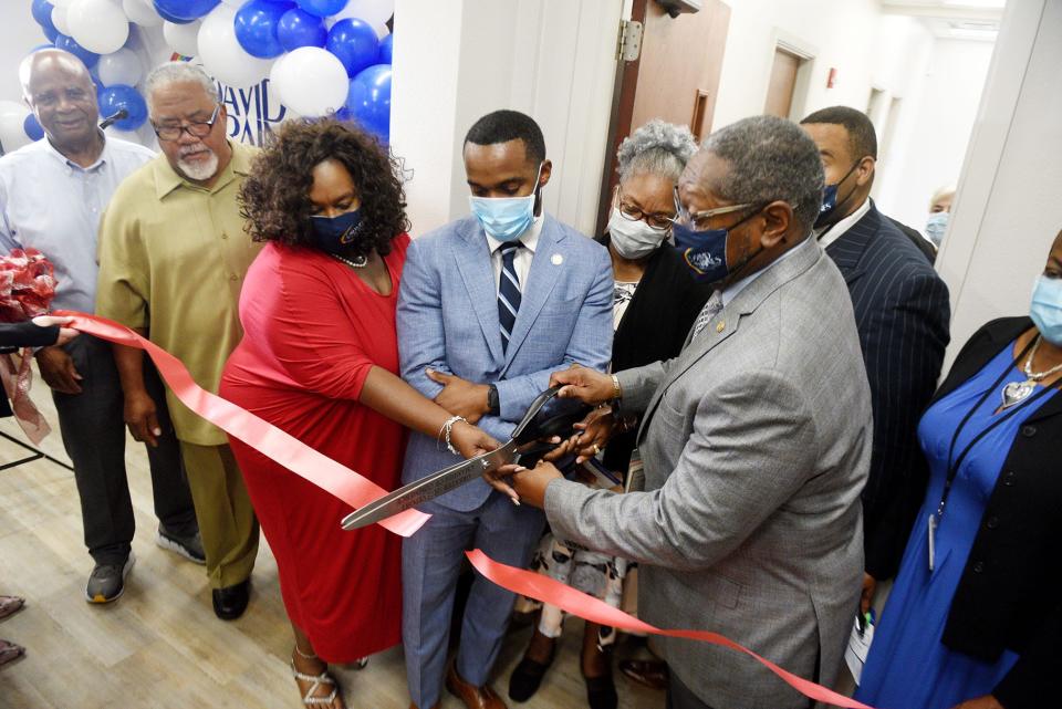 (Center left) David Raines Community Health Center board president Yolanda Coleman, Shreveport mayor Adrian Perkins, and CEO Willie C. White III cut the red ribbon during the grand reopening ceremony of the health center Thursday July 21, 2022.  