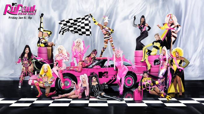 The promo shot of the current cast of RuPaul's Drag Race in various poses around a car with an MTV logo and tires