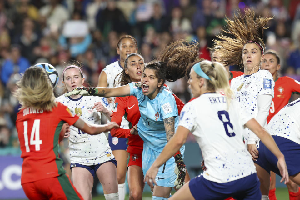 Portugal goalkeeper Ines Pereira, centre, punches the ball clear during the Women's World Cup Group E soccer match between the United States and Portugal in Auckland, New Zealand, Tuesday, Aug. 1, 2023. (AP Photo/Rafaela Pontes)