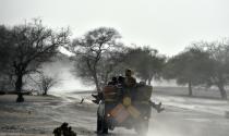 Nigerien soldiers patrol in Bosso, Niger, near the Nigerian border, on May 25, 2015